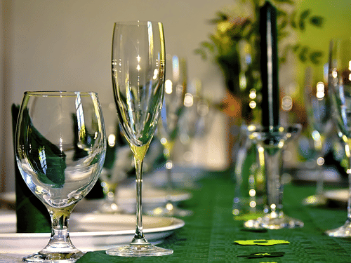 champaige glasses and plates set on a table