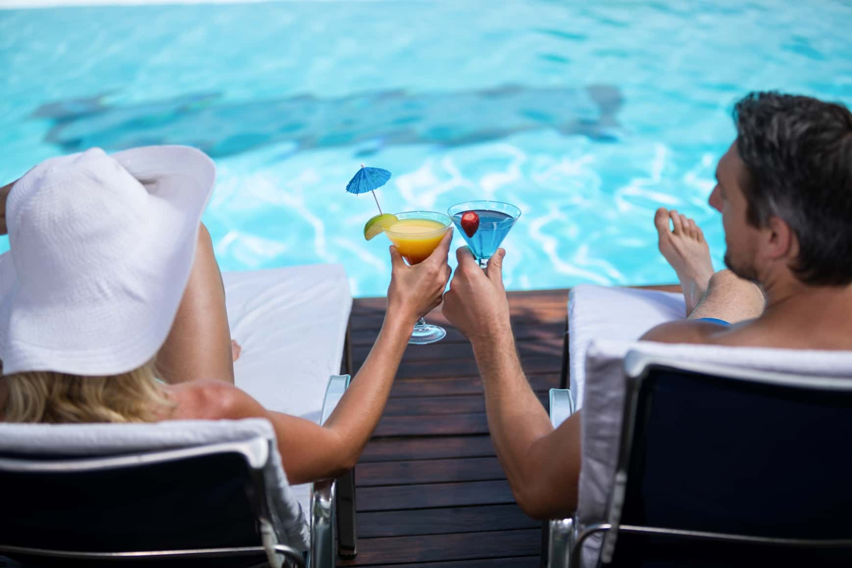 A couple by the swimming pool