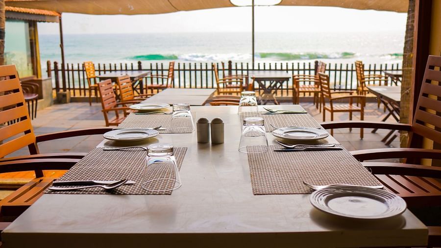 the seating area overlooking the beach at Sea Crest, our Muthukadu restaurant