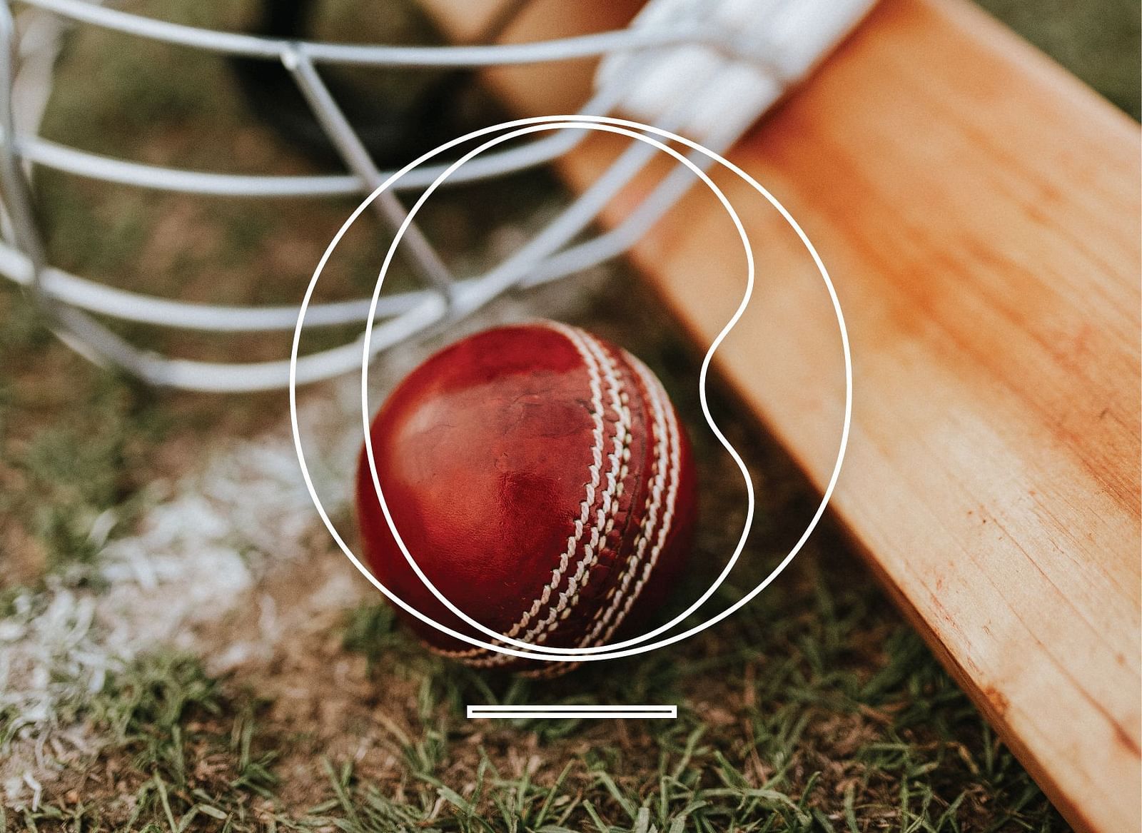 Close up shot of a red coloured cricket ball with a bat kept on lawn at Miros Hotels.