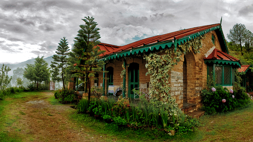 Facade and exterior of cottages captured during the day - Ramgarh Bungalows, Nainital.