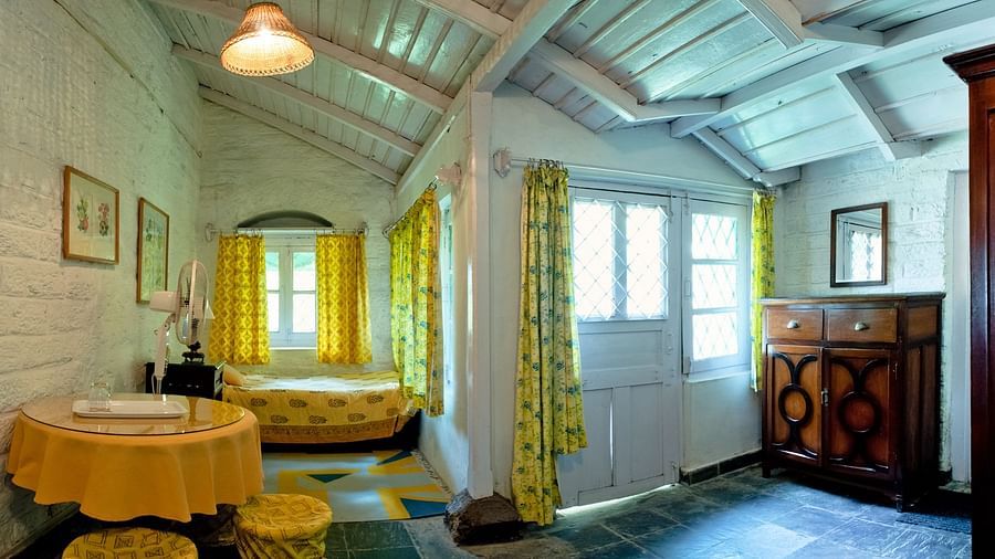 Full view of bird suite with a double bed and a cosy decor - Ramgarh Bungalows, Nainital.