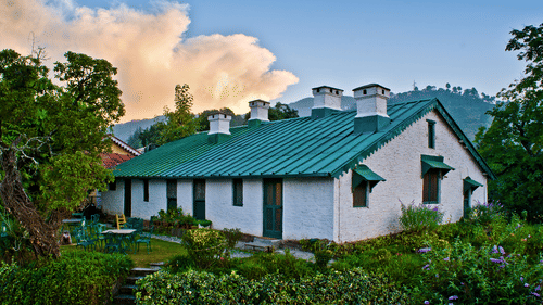A Bungalow surrounded by trees captured during the day - Ramgarh Bungalows, Nainital.