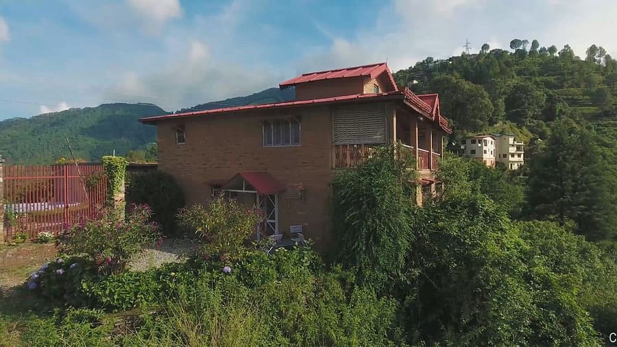 A view of old bungalow amidst the majestic mountains and lush trees - Ramgarh Bungalows, Nainital.