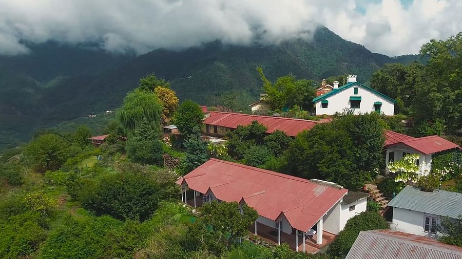 Bird's eye view of the bungalows surrounded by majestic mountains - Ramgarh Bungalows, Nainital.