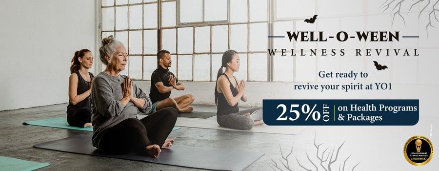 A Halloween Offer banner shows people meditating in a yoga class, promoting a 25% discount on health programs and packages at YO1 Longevity & Health Resorts