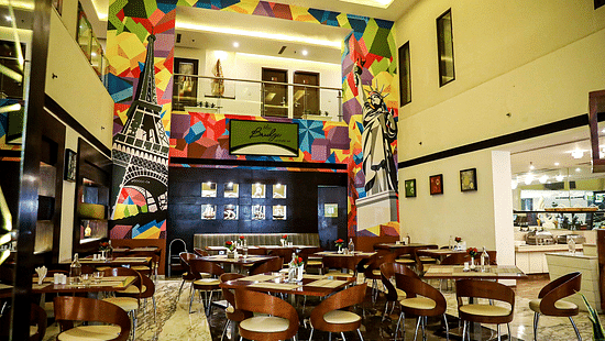 Restaurant featuring chairs and tables arranged in thedining space