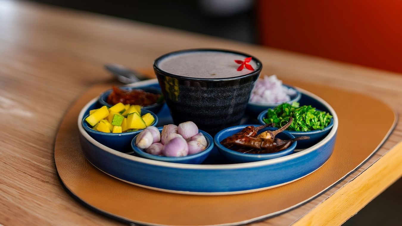 A close-up of a traditional Indian dessert served in a bowl with various toppings at THE RESIDENCY TOWERS RAMESWARAM