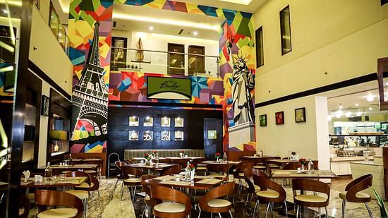 Restaurant featuring chairs and tables arranged in thedining space