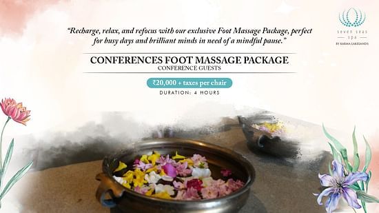 A luxurious foot massage package at a Bengaluru spa, featuring aromatic flowers in a basin, promising relaxation and rejuvenation for tired feet.