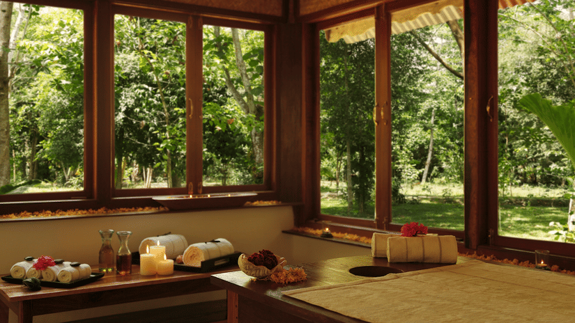 An overview of the interior of Oma Spa with a massage table and other things kept on the table at Barefoot at Havelock.