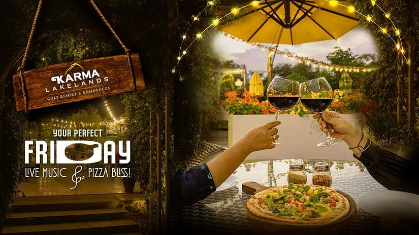An image promoting a Friday night event at Karma Lakelands Golf Resort & Residences, featuring live music, pizza, and a romantic outdoor dining setting.