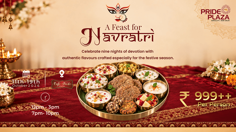A Navratri feast at Cafe Pride with a festive thali, diyas, flowers and traditional decorations.