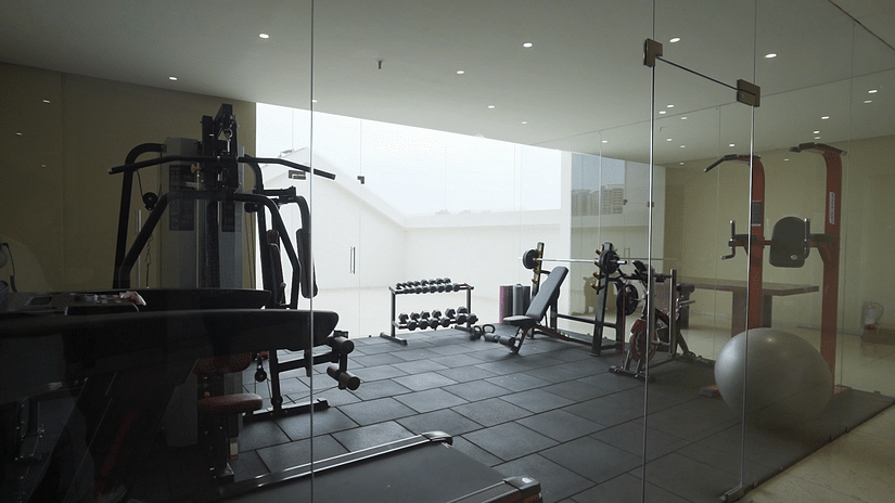 A well equipped gymnasium with huge translucent glass windows - Pride Resort, Rajkot 