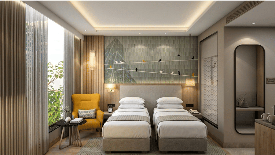 A contemporary twin room at KPG Sarovar Portico, Raj Nagar Extension, Ghaziabad, with twin beds, a recessed ceiling with lighting, and a view of trees outside.