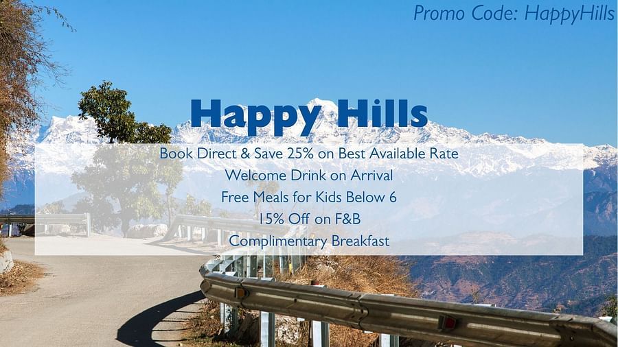 An advertisement for Happy Hills with a background image of a snowy mountain range and a road with a guardrail. The text advertises booking discounts, a welcome drink, free meals for kids, F&B discounts, and complimentary breakfast, and includes a promo co