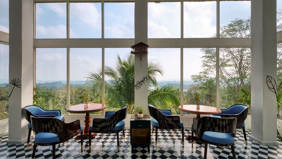 Seating area with stunning views through large windows at Clarks exotica.