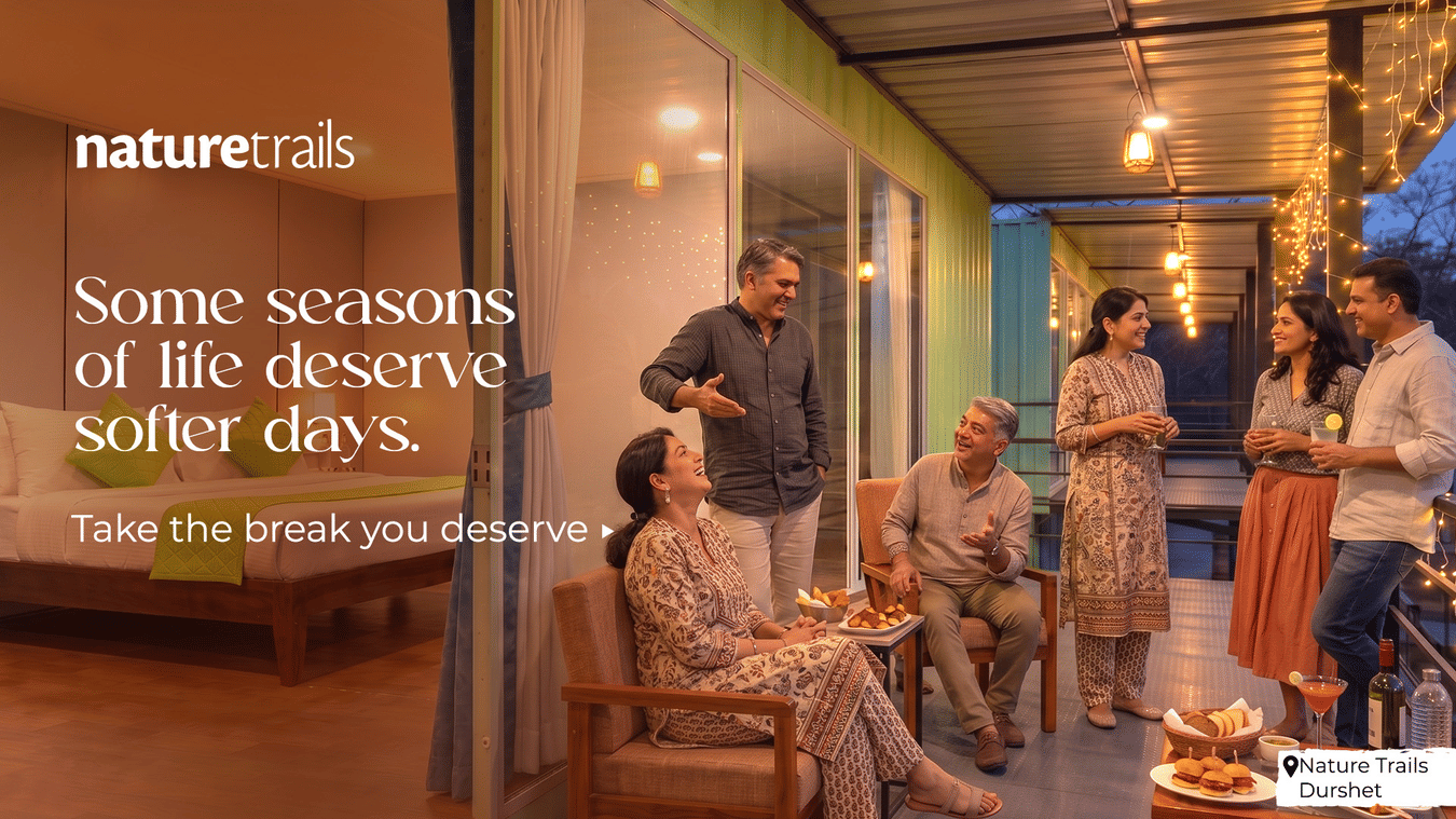 A group of guests relaxing together on an outdoor terrace at a Nature Trails property, enjoying warm and unhurried moments in a lush, peaceful setting.
