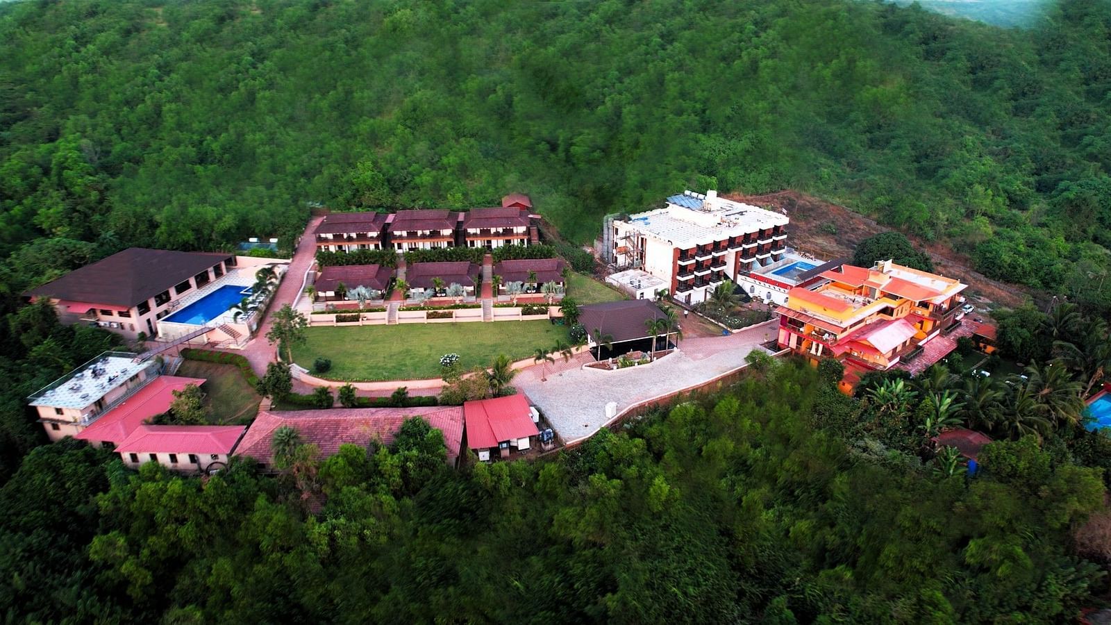 Eagles eye view of a large resort complex in the midst of dense canopy - Crescent Resorts