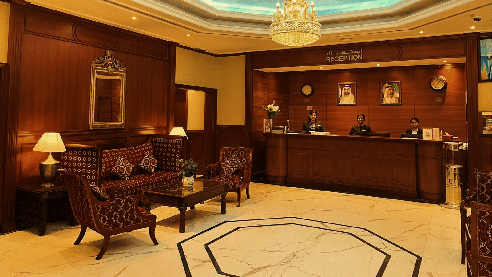 A hotel reception area with furniture at Marco Polo Hotel.