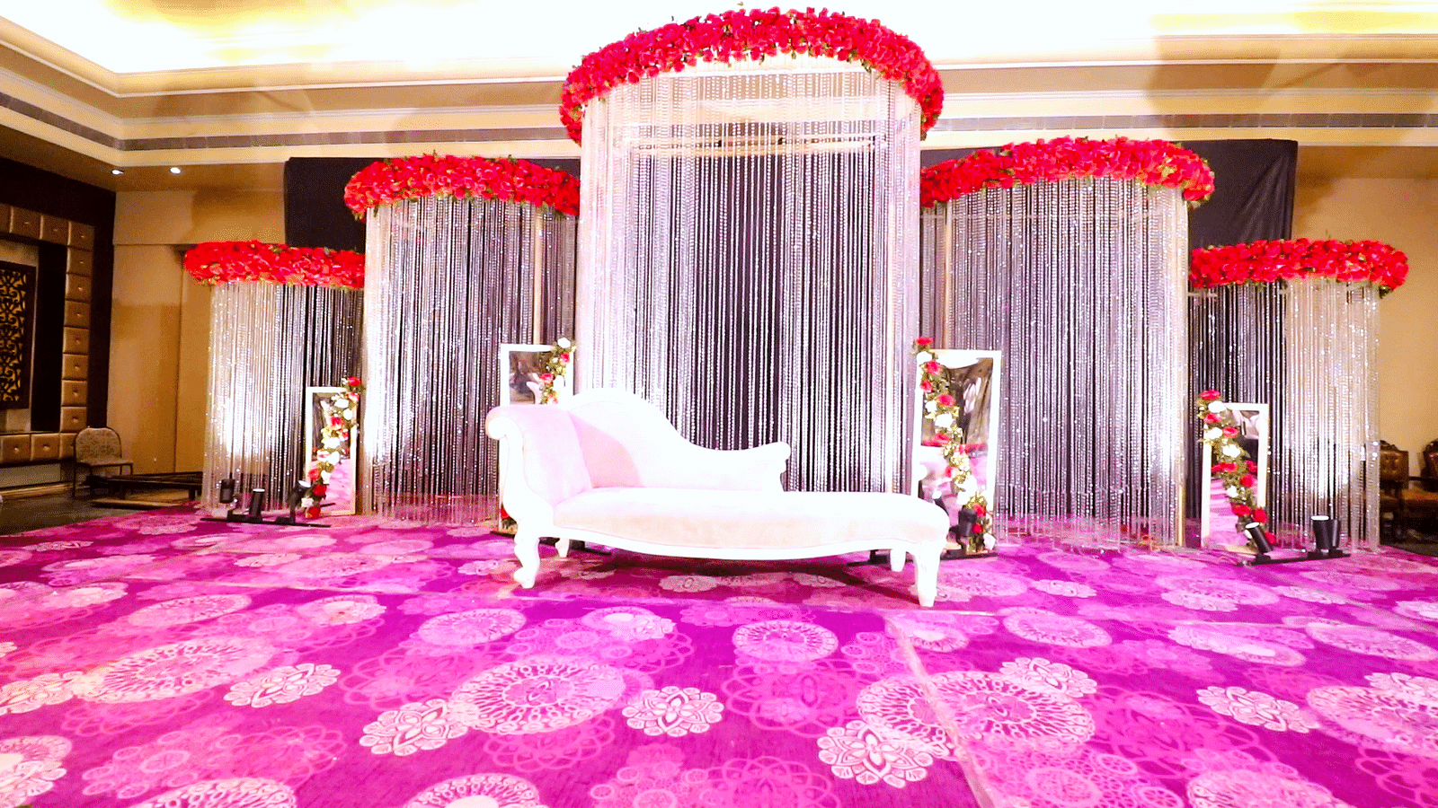 Interior view of the banquet hall containing a decorated couch at Swosti Premium Bhubhaneswar 