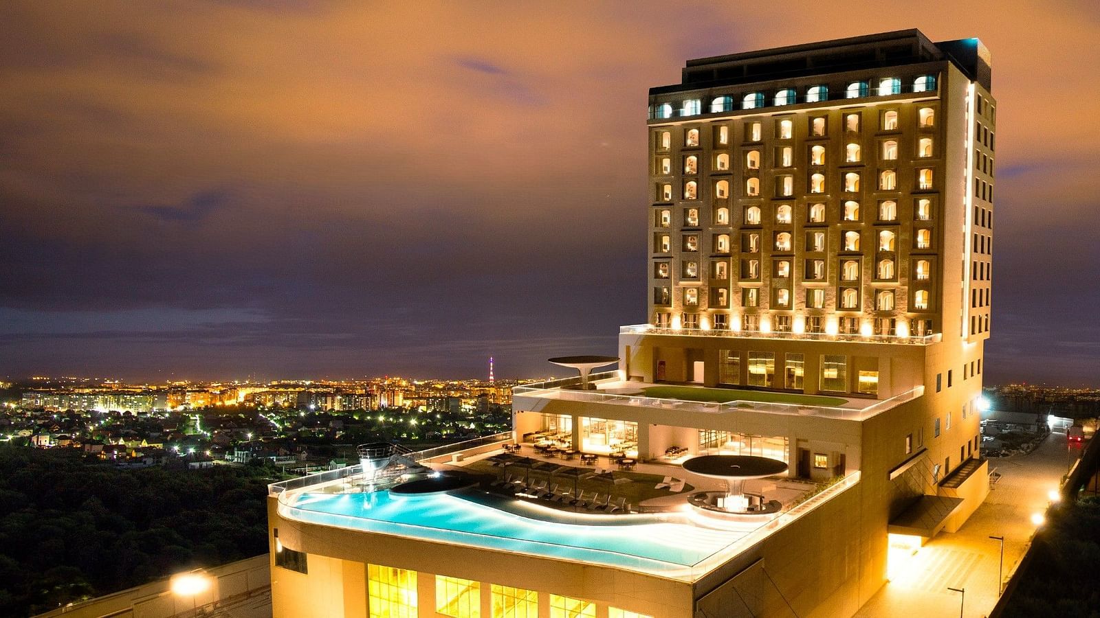 A large shot of facade of Swosti Premium Beach Resort in Puri under the evening sky