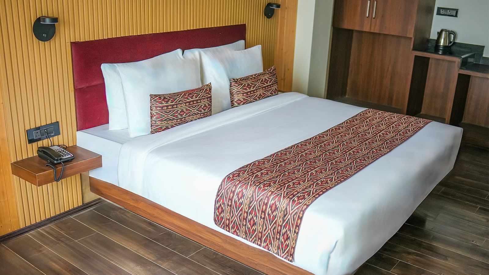 The Standard Room featuring a double bed with a wall mounted bed side shelf - Yashshree Lachen