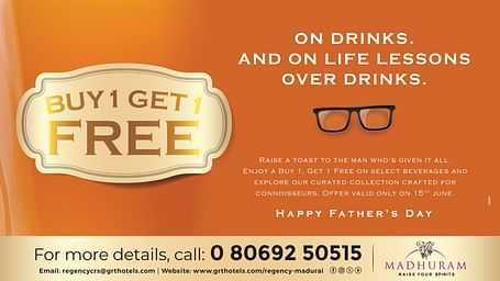  Father’s Day drinks offer by GRT Hotels with “Buy 1 Get 1 Free” text on an orange background featuring glasses and celebration message.