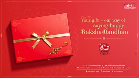 Red gift box with gold ribbon and Rakhi symbolizing GRT Cloud Kitchens' festive Raksha Bandhan offer across multiple cities in India.
