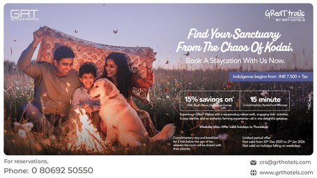 Promotional creative showing a family by a bonfire at Great Trails Kodaikanal by GRT Hotels for the weekday staycation offer.