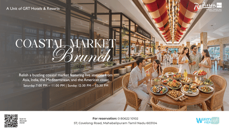 Coastal Market Brunch with live food stations, dining tables and guests at Radisson Blu Resort Temple Bay Mamallapuram.