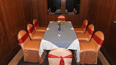 Top view of Royal Room with a long table and chairs arranged around it at Swosti Grand, Bhubaneswar