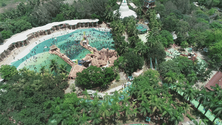An aerial view of the Aquadrome at Water Kingdom with trees surrounding the whole attraction. Water Kingdom is a Goa-trip alternative in Mumbai, where you do not have the hassle of travelling for a longer time.