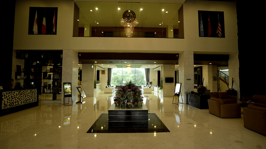 Hotel lobby area with a centrepiece and ample seating area at Narayani Heights Hotel & Resorts, Ahmedabad.