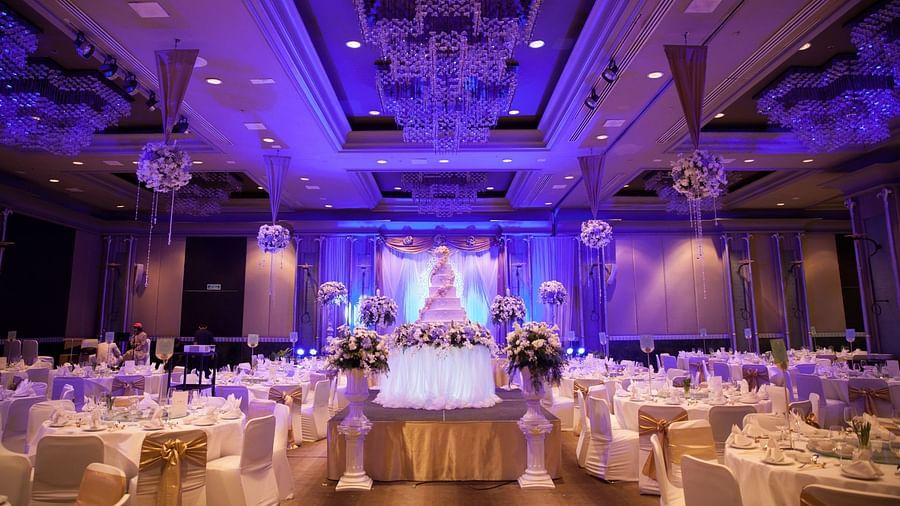 round table seating and chandeliers on the roof of the Banquet Hall at Rhythm Gurugram