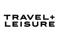 Travel plus Leisure logo in black capital letters on a light grey background.