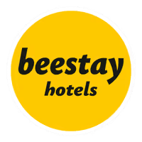beestay Hotels logo on a white background