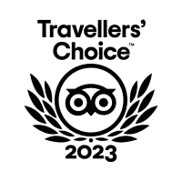 2022 Travellers’ Choice TripAdvisor award logo featuring black owl emblem and laurel wreath.