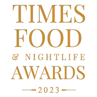 Times Food & Nightlife Awards 2023 logo in gold text on a white background.