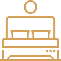 This icon represents a comfortable king size bed.