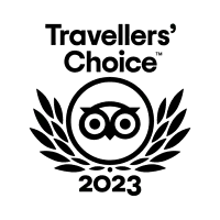 2022 Travellers’ Choice TripAdvisor award logo featuring black owl emblem and laurel wreath.