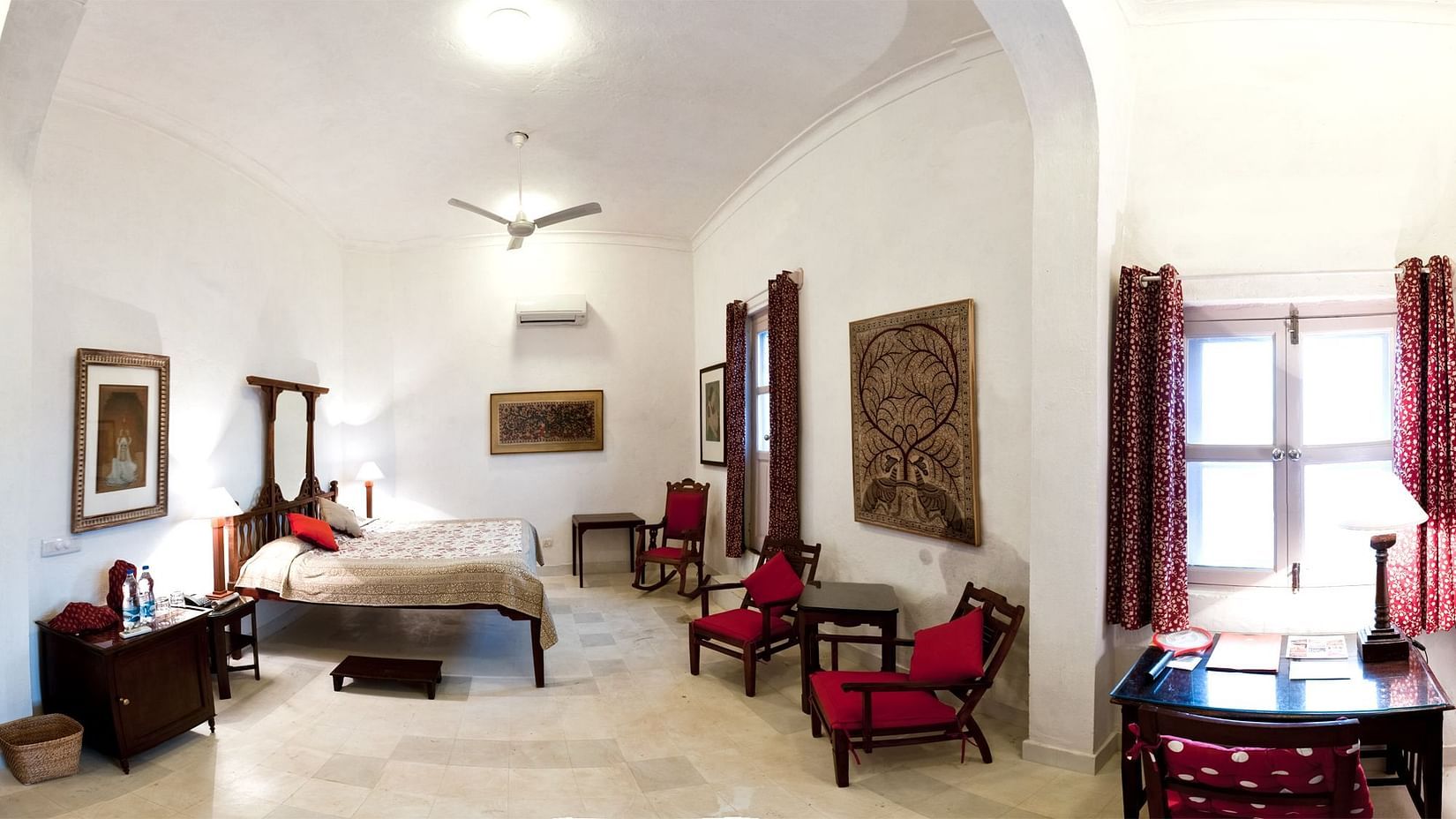 Hill Fort Kesroli 14th Century Alwar - interior view of the Mynah Mahal with a queen size bed and numerous seating options