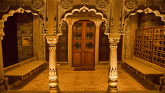 Deo Bagh - 17th Century, Gwalior - an arch-shaped hallway leading to a closed door