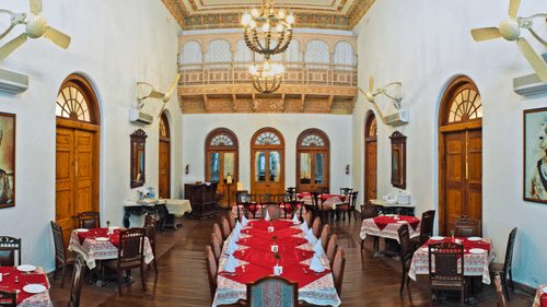 Different styles seating arrangements with a chandelier on the roof - The baradari palace