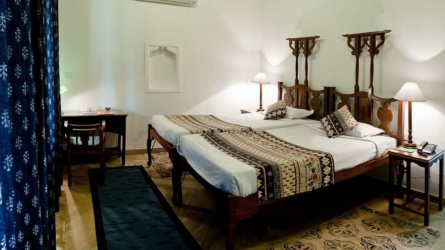 Deo Bagh - 17th Century, Gwalior - twin sharing beds at the Jai Vilas - Naubagh / Garden View room in Gwalior