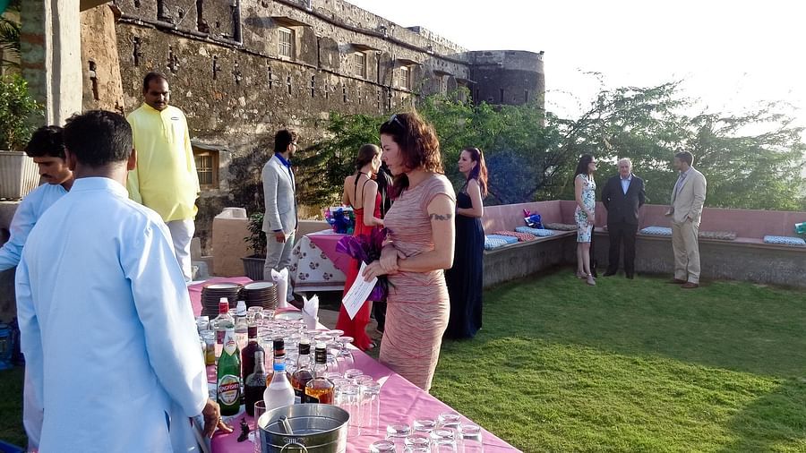 People walking around an outdoor wedding venue - weddings in Rajasthan
