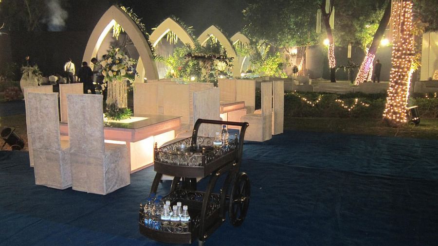Decorated chairs and table with a beverage cart during a wedding - The Baradari Palace