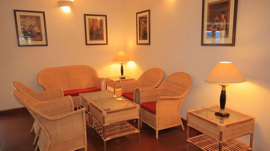 The Tower House - a beautiful room with couch with dim lights and a lampshades