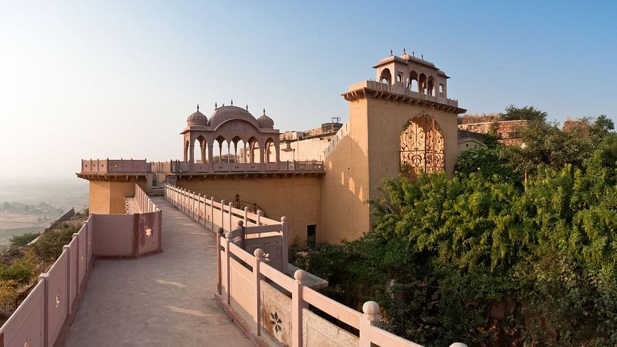 Facade shot of Tijara Fort-Palace - 19th Century, Alwar with clear blue sky in the background.