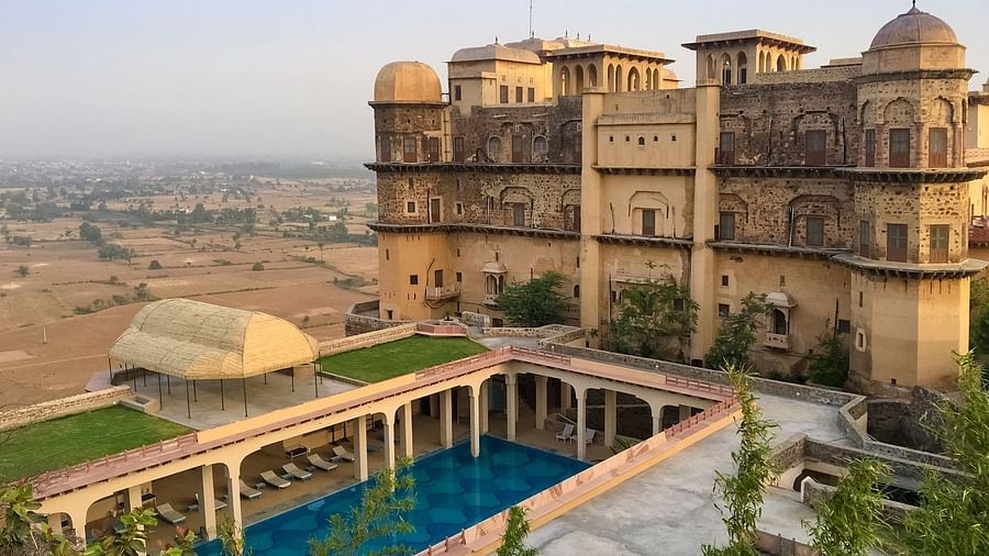 Facade shot of Tijara Fort-Palace - 19th Century, Alwar with clear blue sky in the background.